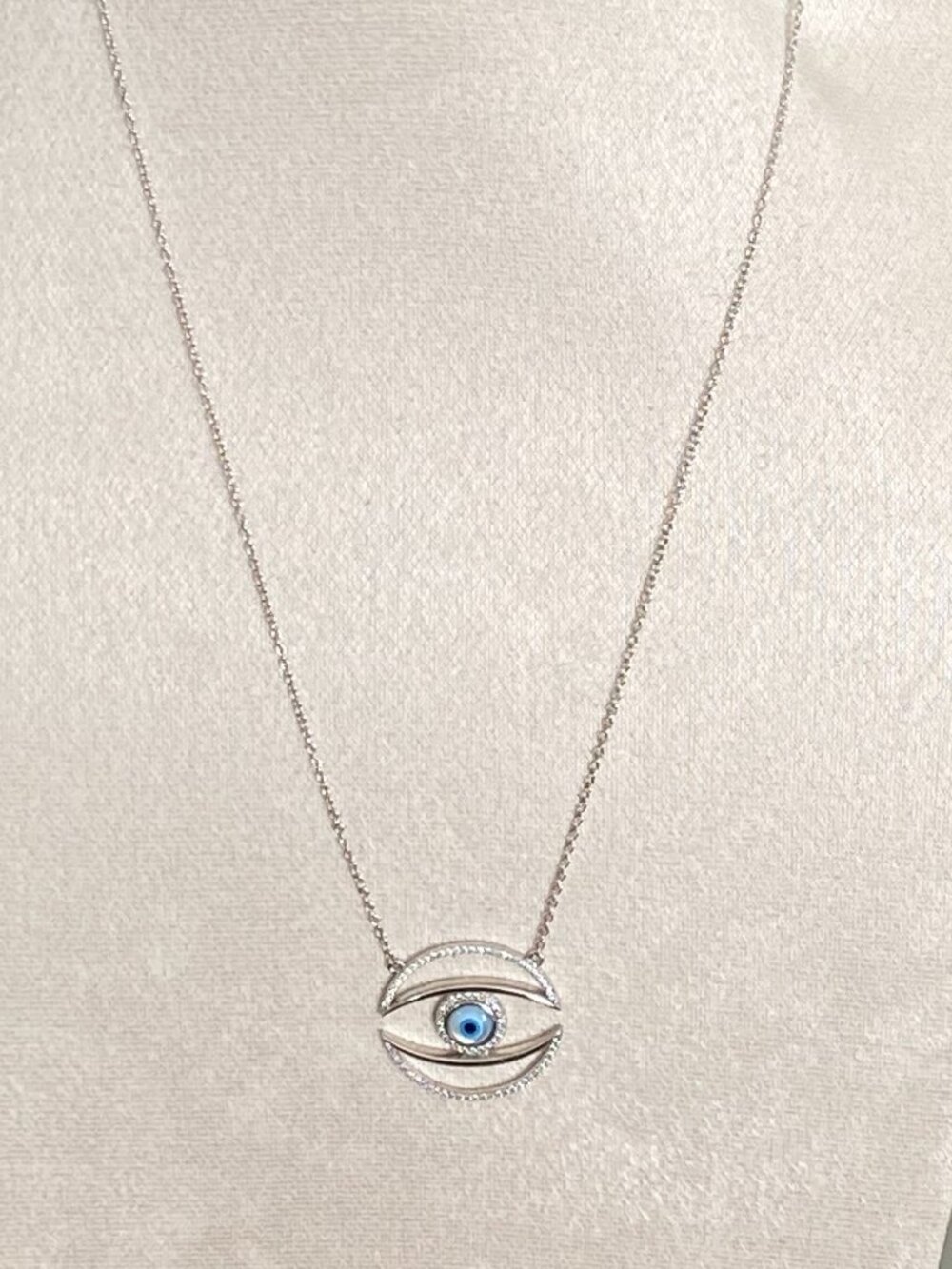 Sterling Silver evil eye pendant necklace adorned with Crystal